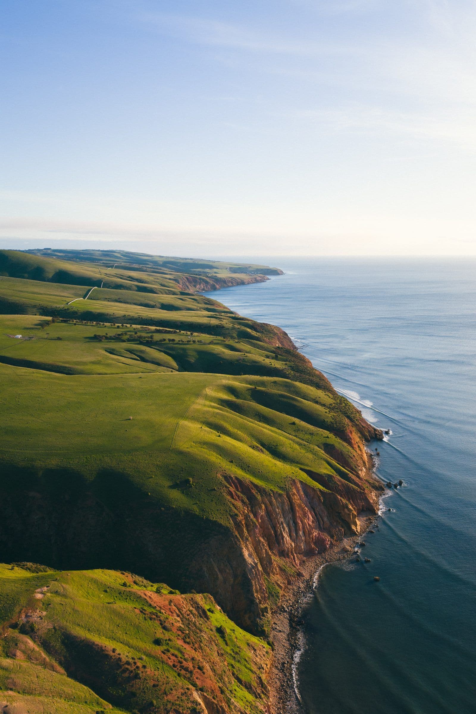Rolling green headlands falling into the sea